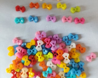 Lot of 20 Tiny Bow Buttons in plastic - 9 mm - 12 colors available