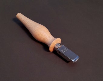 May include: A wooden handled leather working tool with a metal blade. The blade is labeled "2mm" and "Cobra".