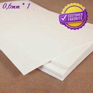 May include: A stack of off-white paper sheets. The text "0.6mm * 1" is in the upper left corner. A purple and yellow "Customer Favorite" badge is in the upper right corner.