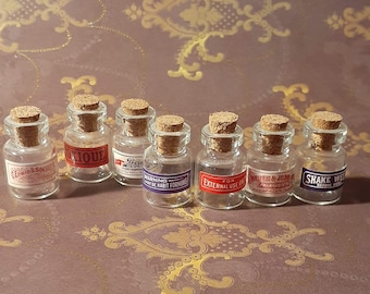 Fun Set of 7 Dollhouse Size Miniature Antique Victorian Style Clear Glass Apothecary / Pharmacy Medicine Bottles. Labeled w/Cork Stoppers.
