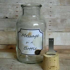 May include: A clear glass bottle with a cork stopper. The bottle has a label that says "Message in a Bottle".