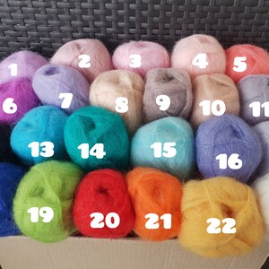 May include: Twenty-three balls of yarn in various colors, numbered 1 through 23. The yarn is soft and fluffy, and the colors are bright and vibrant.