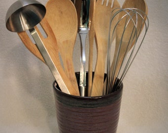 You are viewing a handmade, ceramic stoneware, utensil holder or bathroom caddy.  Microwave, food and dishwasher safe.