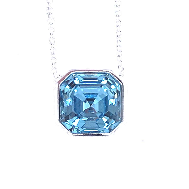 Silver blue topaz pendant Free postage