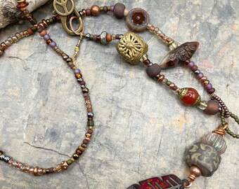 Artisan Beaded Necklace At Contents Jewelry: Asymmetrical, Earthy, Beachside, Feather, Travel, BOHO