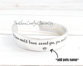 May include: Silver-colored cuff bracelet with the inscription "If love could have saved you, you would be here." A paw print is also engraved on the bracelet. The Etsy shop name "SouthernComfortZone@etsy" is also visible.