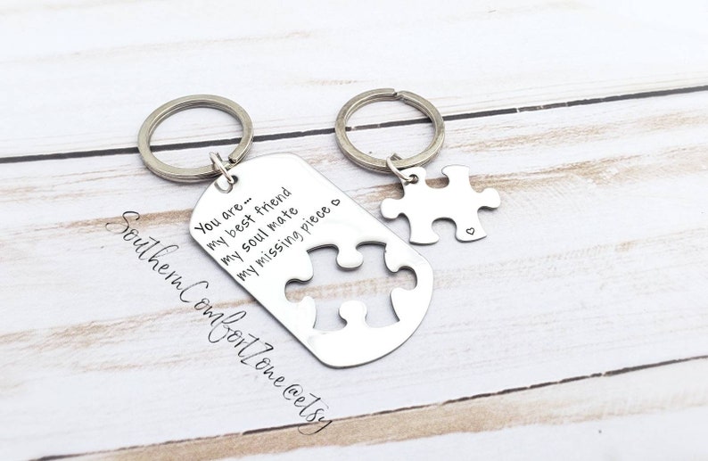 May include: Two silver keychains with a puzzle piece design. One keychain has the text "You are... my best friend my soul mate my missing piece o".
