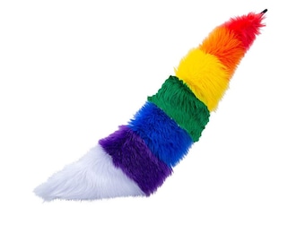 May include: A colorful, rainbow-striped faux fur tail, featuring a spectrum of colors from red to purple, with a white tip. The tail is designed with a slight curve and a black attachment point, perfect for costumes or playful accessories.