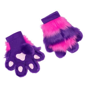 May include: A pair of purple and pink faux fur gloves. The gloves have a paw-like design with pink paw pads and a purple cuff. The fingers are separated, and the fur is striped with pink and purple.
