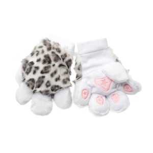 May include: A pair of plush gloves with a unique design. One glove features a spotted pattern in black and gray, while the other is white with pink paw pads and star accents. The gloves are designed to resemble animal paws.