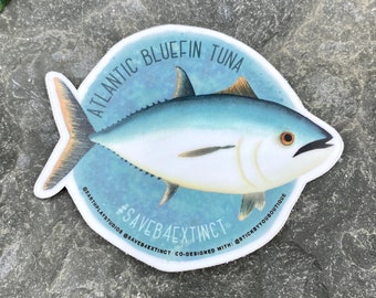 May include: A sticker featuring an illustration of an Atlantic Bluefin Tuna with the text "#SAVEB4EXTINCT" and the hashtags "@earthplaystudios" and "@stickyyouboutique".
