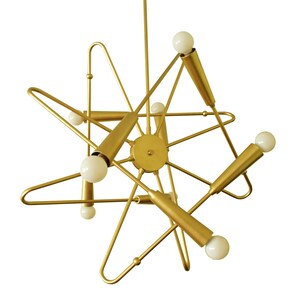 May include: A gold metal chandelier with six light bulbs. The chandelier has a geometric design with a starburst shape.
