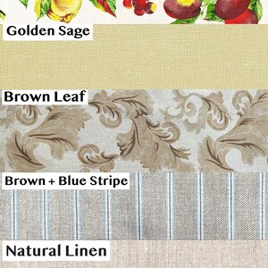 Puede incluir: Muestras de tela con diversos patrones y texturas. Incluye un estampado de frutas con melocotones y cerezas, un liso color salvia dorado, un dise&ntilde;o de hojas marrones, una raya marr&oacute;n y azul, y lino natural.