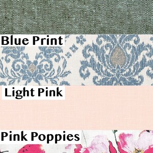 May include: A collection of fabric swatches. The top swatch is aqua gray chambray. The second swatch is a blue and white floral print. The third swatch is light pink. The bottom swatch is white with pink poppy floral print.