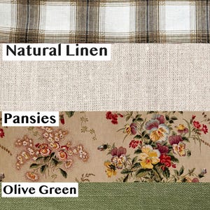 May include: A fabric swatch display featuring four distinct sections: a white and brown plaid print, a solid natural linen texture, a beige fabric with a colorful pansies floral pattern, and a solid olive green textile with a visible weave.