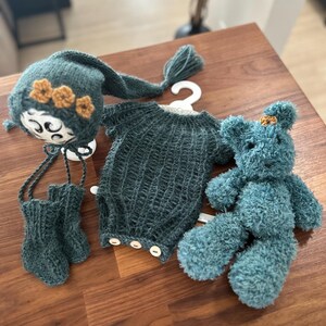 May include: A handmade wooden sign with the text "Welcome" in a playful font. The sign is painted white with a distressed finish, and features a small, decorative heart. Dimensions are approximately 12 inches wide and 6 inches high.