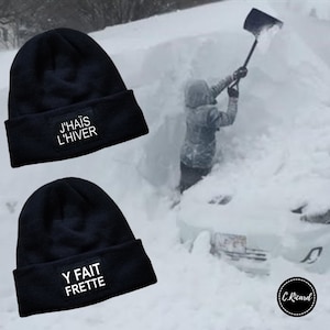 May include: Two black knit beanies with white text. The first beanie says "J'hais L'hiver" and the second beanie says "Y Fait Frette".