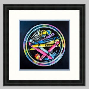 May include: A colorful still-life painting of a glass bowl filled with Crayola crayons. The crayons are various colors, including pink, yellow, blue, and purple. The bowl is set against a dark background and framed in black.