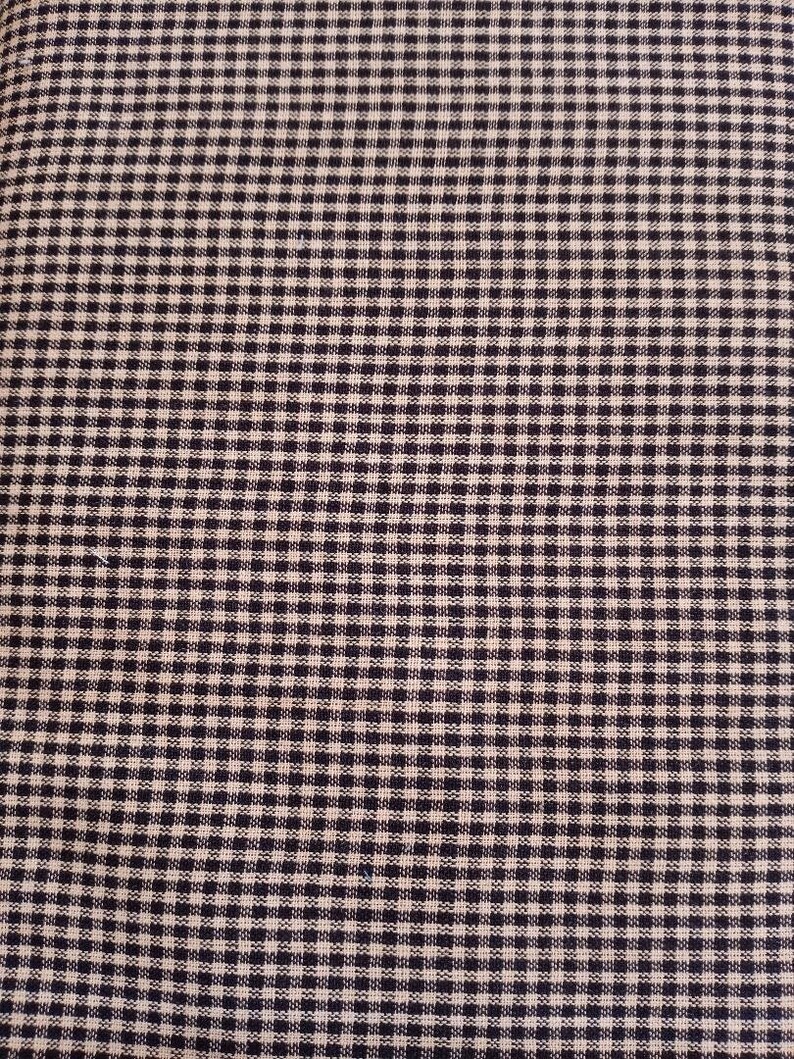 May include: Black and white gingham fabric with a small check pattern.