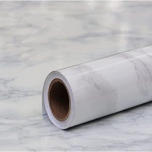 May include: A roll of white marble contact paper with a gray veining pattern. The paper is rolled up and the end of the roll is visible.
