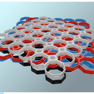 May include: A collection of interlocking hexagonal plastic pieces in red, white, blue, and black. The pieces are arranged in a honeycomb pattern, forming a three-dimensional structure. The design is modern and geometric.