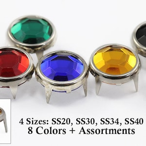 May include: Assortment of eight colors of round, faceted, glass rhinestones with silver settings and prongs.  The rhinestones are available in four sizes: SS20, SS30, SS34, and SS40.