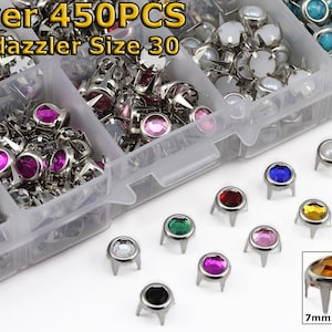 May include: A clear plastic organizer filled with various colors of Bedazzler size 30 studs. The studs have silver metal bases and colorful, faceted gems. The image includes text that reads "Over 450PCS" and "7mm Size 30".