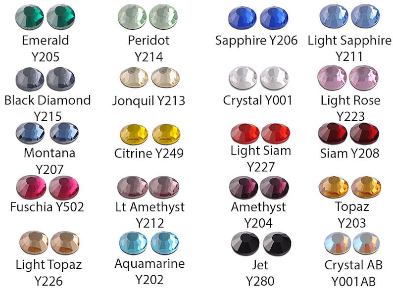 May include: A collection of faceted, round gemstones in various colors, including emerald, sapphire, and amethyst. Each color is labeled with its name and a corresponding code. The gemstones are displayed in pairs, showcasing their brilliance.