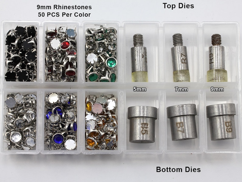 May include: A clear plastic organizer filled with various rhinestones in multiple colors, including black, red, green, and blue. The text "9mm Rhinestones" and "50 PCS Per Color" is visible. Also included are top and bottom dies for setting the rhinestones.