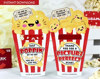 May include: Printable gift card holder shaped like a popcorn bucket with a red and white striped design. The bucket has a slot for a gift card and features a cute cartoon popcorn kernel with the text "Just Poppin' by to say Thank You for all you do!" and "Thank you for a Picture Perfect Year!"