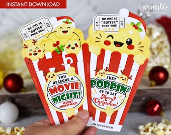 May include: Two printable Christmas gift card holders shaped like popcorn boxes. The boxes are red and white with a green and red Christmas design. The text on the boxes reads "You deserve a movie night! Merry Christmas!" and "Just poppin' by to say Merry Christmas!"