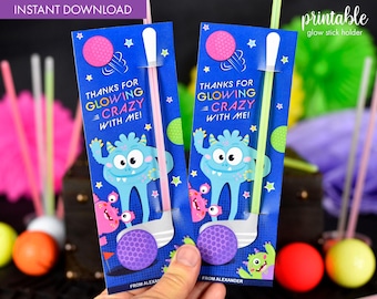 May include: Two printable glow stick holders featuring a blue background with a cartoon monster holding a golf club. The text on the holders reads "Thanks for glowing crazy with me!"