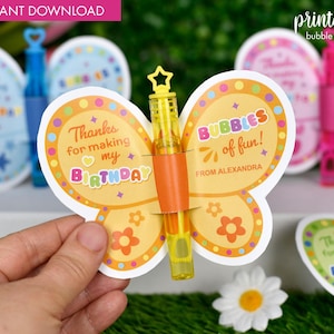 May include: Printable butterfly-shaped bubble holder with a yellow bubble wand. The butterfly has a colorful design with the text "Thanks for making my birthday" on one side and "Bubbles of fun! From Alexandra" on the other side.