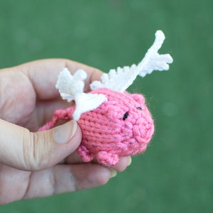 When pigs will fly. Pink hand made piggy with white wings.