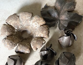 A collection of salvaged antique French hand forged metal flowers and leaf decorations #7