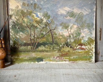 An Impressionist style oil on board painting of a French landscape