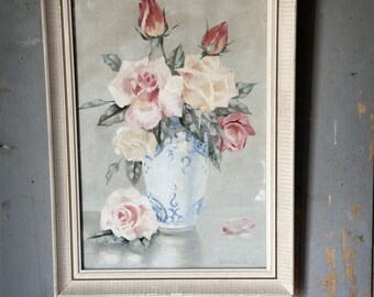 A lovely mid-20th century oil on canvas board painting of pink roses in a Chinese blue and white vase