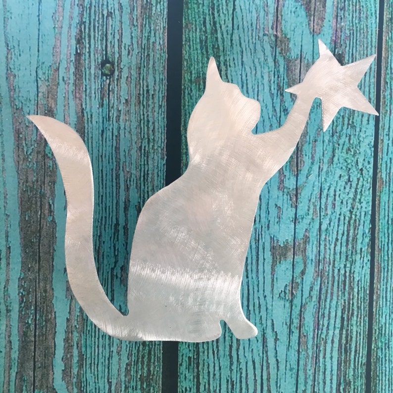 Kitty Cat Touching a Star with her paw Tree Topper, beautiful silver silhouette handcrafted of metal, it sits secure on the tree top with its spring loaded clip, available with a garden stake or wall hangers, has a beautiful silver shine