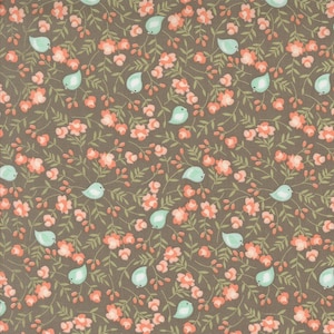 May include: A brown fabric with a repeating pattern of small pink flowers and light blue birds. The fabric has a subtle texture.