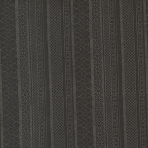 May include: Dark gray fabric with vertical stripes. The stripes alternate between solid, patterned with a diamond grid, and patterned with a floral and curved line design. The fabric has a subtle texture.