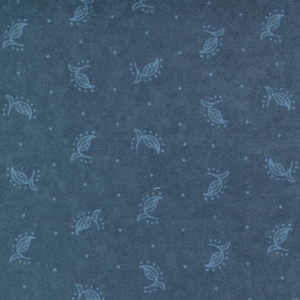 May include: A blue fabric with a white floral pattern. The fabric has a subtle texture and a slightly faded look.