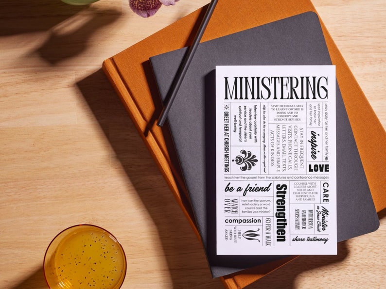 May include: A white card with black text outlining ways to minister to others. The text includes phrases like "inspire love", "strengthen", "be a friend", "watch over", "compassion", "care", and "share testimony".