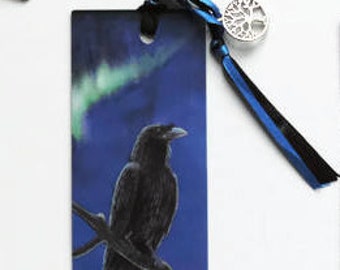 Norse mythology vikings Bookmark: Raven and Mjolnir . Black bird with Hammer of Thor in Pagan sky with aurora borealis / northern lights. .