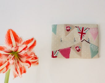 Bunting fabric key rack, bag holder, jewellery display, medal hanger; Fryetts pink bunting fabric; 3 zinc hooks.