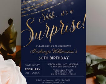 May include: A rectangular invitation card with a dark navy blue background featuring gold string lights at the top. The text reads: Shhh... it's a Surprise! Please join us to celebrate Mackenzie Williamson's 50th Birthday, Saturday February 20 - 20XX.