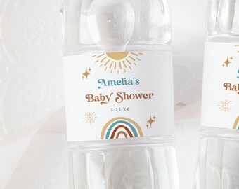 May include: A white label with a gold sun, rainbow, and stars. The label reads "Amelia's Baby Shower" and "5-25-XX".