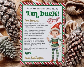 May include: A festive Christmas card with a red and green striped border. The card features a cartoon elf with a green and white striped outfit and a red hat. The card reads "From the desk of Santa Claus I'm back!" and "Dear Sebastian. You're officially back under Elf Watch! That's right - I'm here again, and I've missed you so much! Just a little reminder of how this works: I'm here to watch and listen, and to share with Santa anything he might be missin'. Last Christmas was full of fun, but let's not forget the reason I'm here! Be on your very best behavior, and always think twice about being naughty or nice. Now... let's make this season one to remember! Love. Your Elf Jingles"