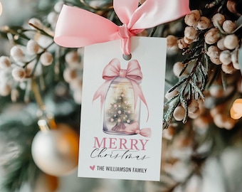 May include: A pink and white Christmas gift tag with a watercolor illustration of a jar with a miniature Christmas tree inside. The tag says "Merry Christmas" and "The Williamson Family".