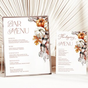 May include: A Thanksgiving menu with a watercolor illustration of pumpkins and a plaid scarf. The menu includes starters, main course, and desserts. The text reads "Thanksgiving Menu".