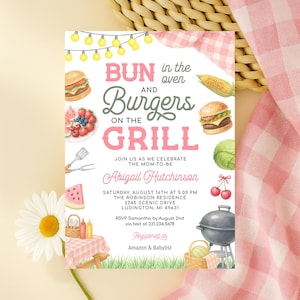 May include: A baby shower invitation with the text "Bun in the Oven and Burgers on the Grill." The invitation includes watercolor illustrations of food items like burgers, watermelon, and corn on the cob. The event details are also included.